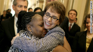 Former U.S. Rep. Gabrielle Giffords hugs House Cloak Room attendant Ella Terry after resigning from Congress in January 2012