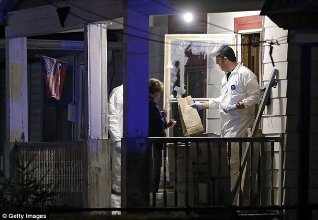 The search: FBI investigators remove a bag of evidence from the home that belongs to Ariel Castro, the man that Amanda Berry named during her frantic 911 call as being her captor