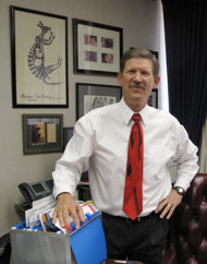 In this Friday Aug. 26, 2011 photo, Fresno County School Superintendent Larry Powell poses for a photo in his office, in Fresno, Calif. Powell is forgoing $800,000 in compensation over the next three years of his term. Until his term expires in 2015, Powell will run 325 schools and 35 school districts with 195,000 students, all for less than a starting California teacher earns. As he prepares for retirement, he wants to ensure that his pet projects survive California budget cuts. (AP Photo/Tracie Cone)