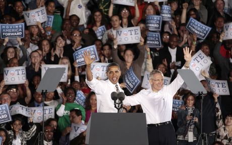 ASSOCIATED PRESS President Barack Obama, left, and Nevada Sen. Harry Reid wave to the crowd at the end of a rally Friday, Oct. 22, 2010, in Las Vegas. 