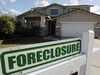 ** FILE ** A foreclosure sign sits outside a home for sale in Phoenix, Tuesday, Feb. 17, 2009. (AP Photo/Ross D. Franklin)