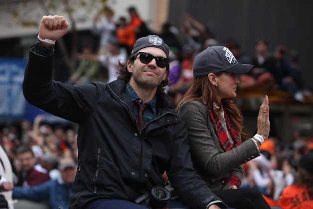 Giants pitcher  Barry Zito (left) pumps his fist as he rides along the parade route during the San Francisco Giants World Series victory parade on Wednesday, October 31, 2012 in San Francisco, Calif. Photo: Lea Suzuki, The Chronicle / SF
