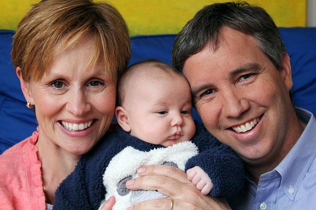  	Douglas Kennedy and his wife Molly with their son Boru. 