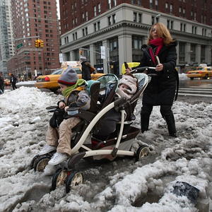 OH, BABY, IT’S SLUSH A MESS! Martina George and her grandkids get mired in slush yesterday in Chelsea.